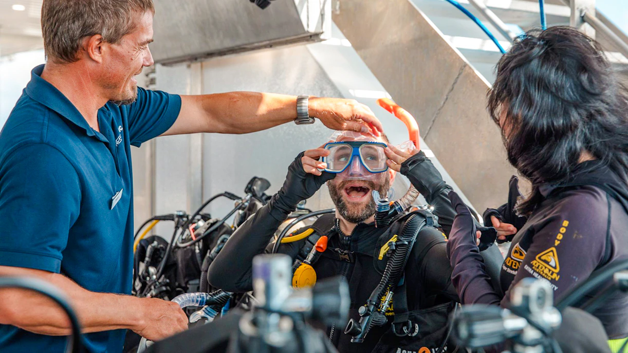 Tourists preparing for a dive on a Great Barrier Reef cruise.
