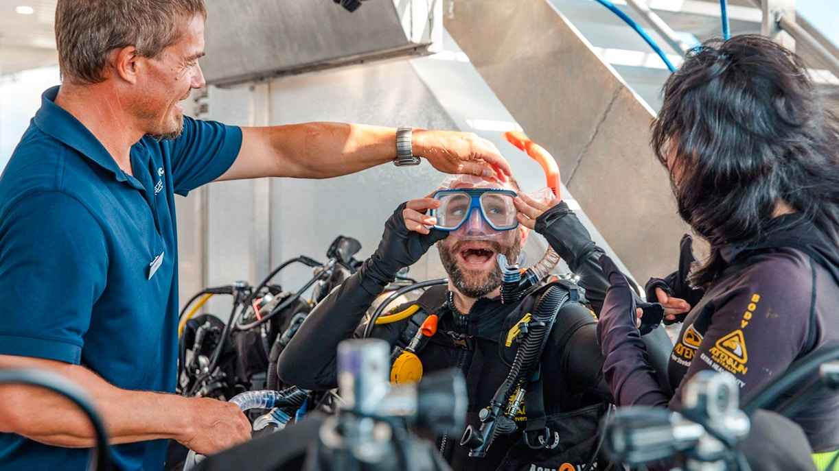 Tourists preparing for a dive on a Great Barrier Reef cruise.