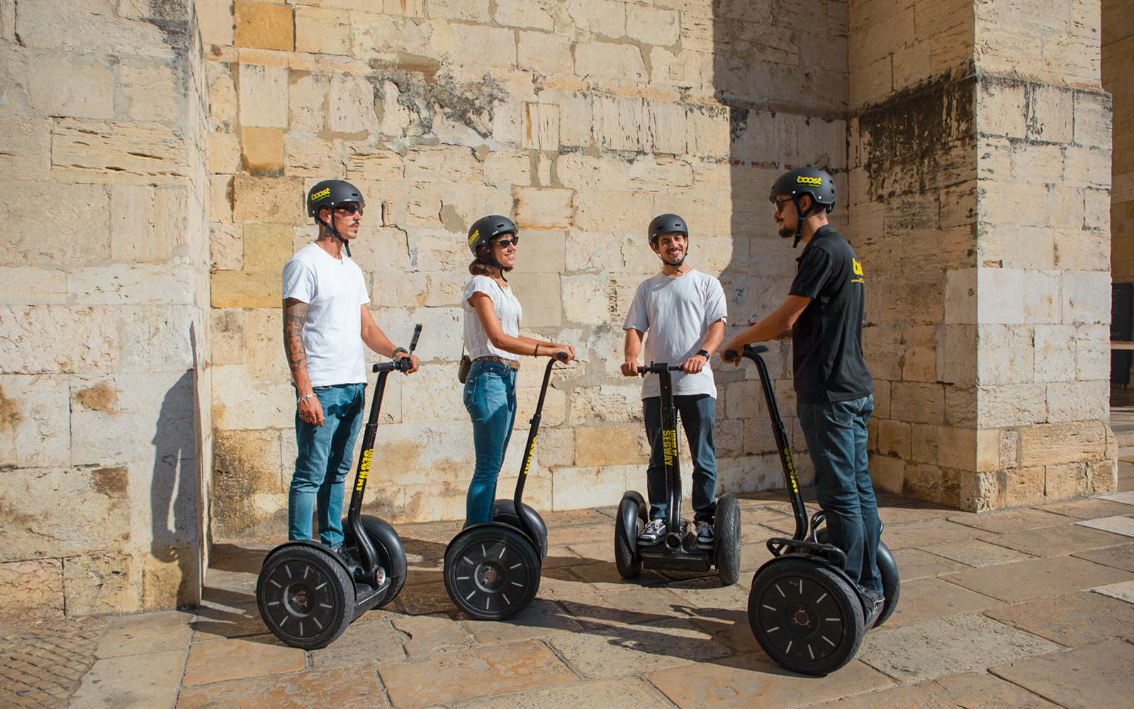 Tourists on Segways during the Alfama Medieval Guided Tour.