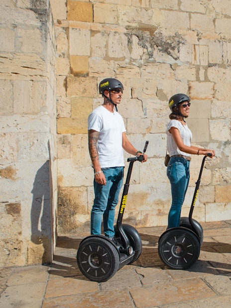 Tourists on Segways during the Alfama Medieval Guided Tour.