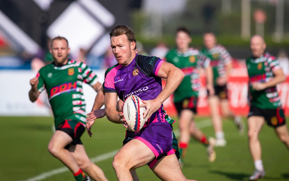 Rugby players in action at Emirates Dubai 7s tournament.