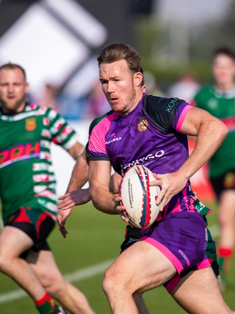 Rugby players in action at Emirates Dubai 7s tournament.