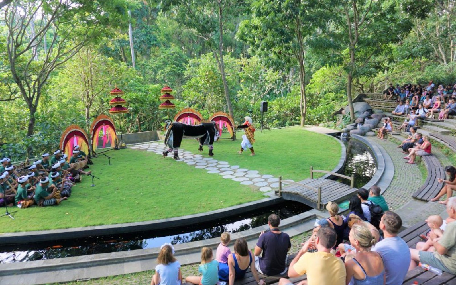 Outdoor performance at Sacred Monkey Forest Ubud with traditional dancers and audience.
