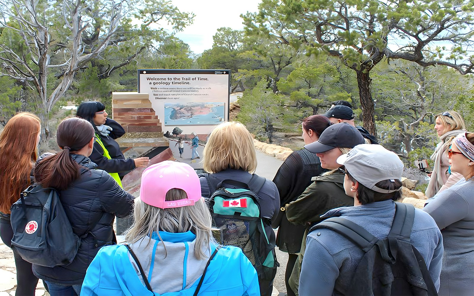 Guide engaging with visitors at Grand Canyon South Rim, Las Vegas bus tour.