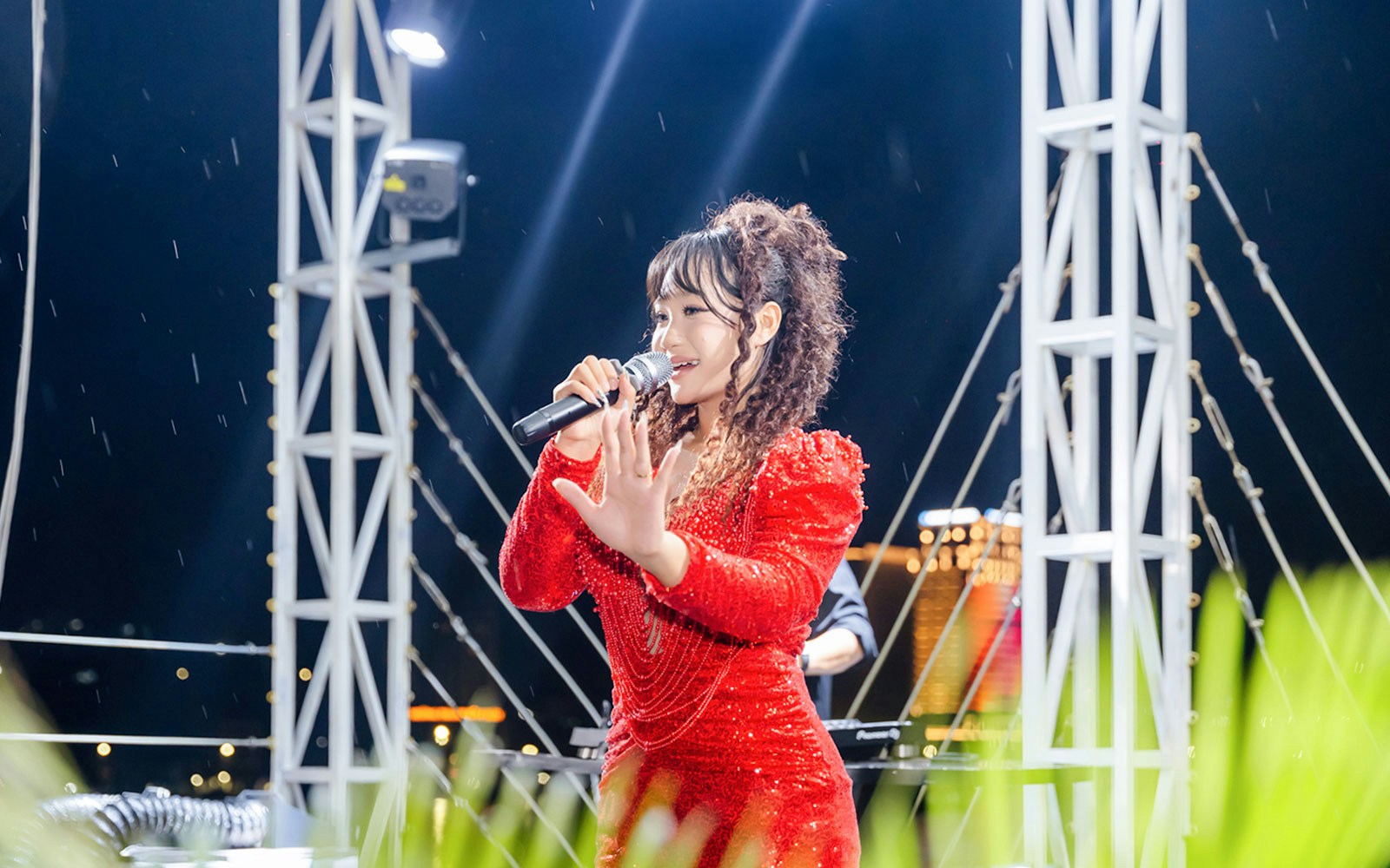 Singer performing on stage during Ha Long Bay 5-Star Cruise.
