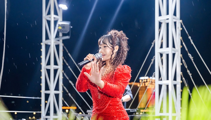 Singer performing on stage during Ha Long Bay 5-Star Cruise.