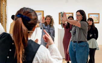 Visitors engaging in an interactive tour at the National Gallery of Victoria.
