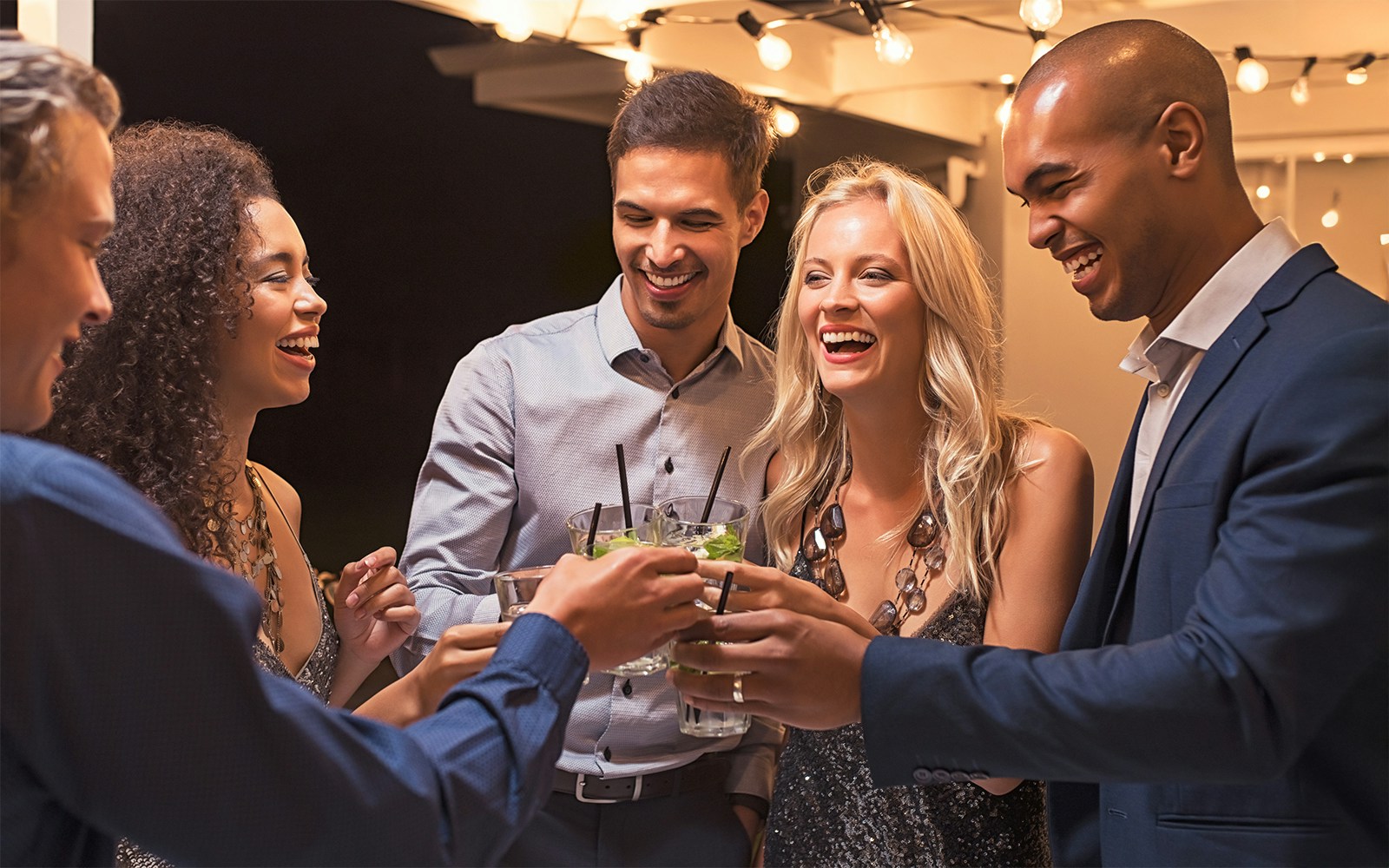 Group of friends toasting drinks at The High Roller, Las Vegas.