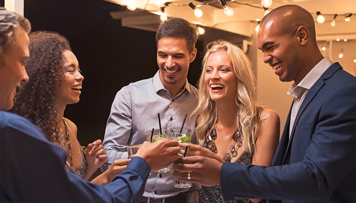 Group of friends toasting drinks at The High Roller, Las Vegas.