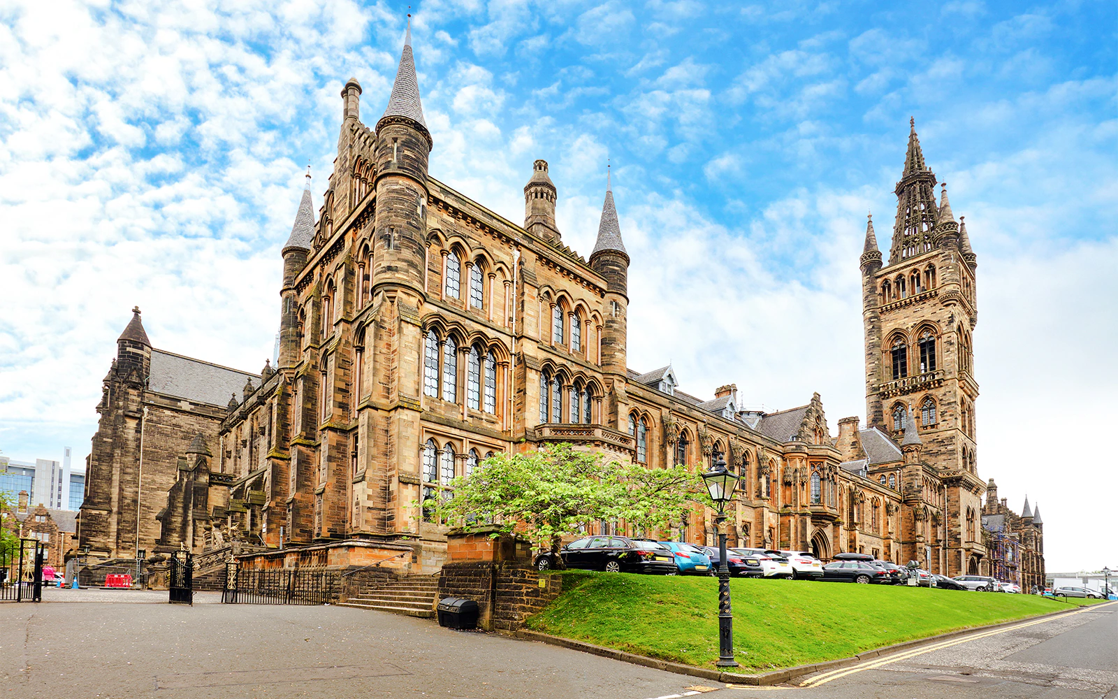 University of Glasgow Main Building with Gothic architecture and tall spire.