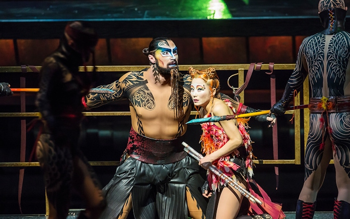 Performers in elaborate costumes during Cirque du Soleil KÀ show.