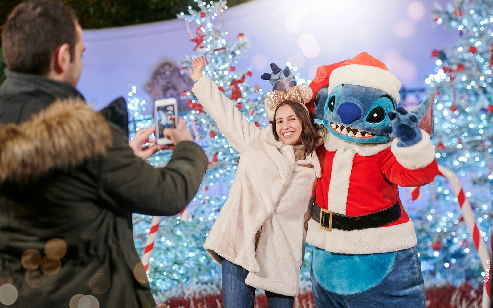 Disneyland Paris Christmas meet and greet with favorite characters in festive attire.