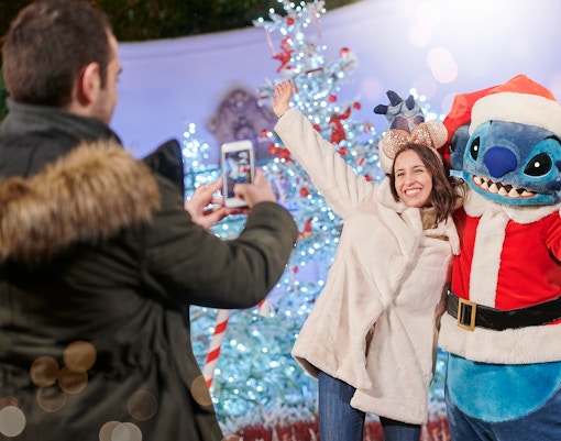 Disneyland Paris Christmas meet and greet with favorite characters in festive attire.