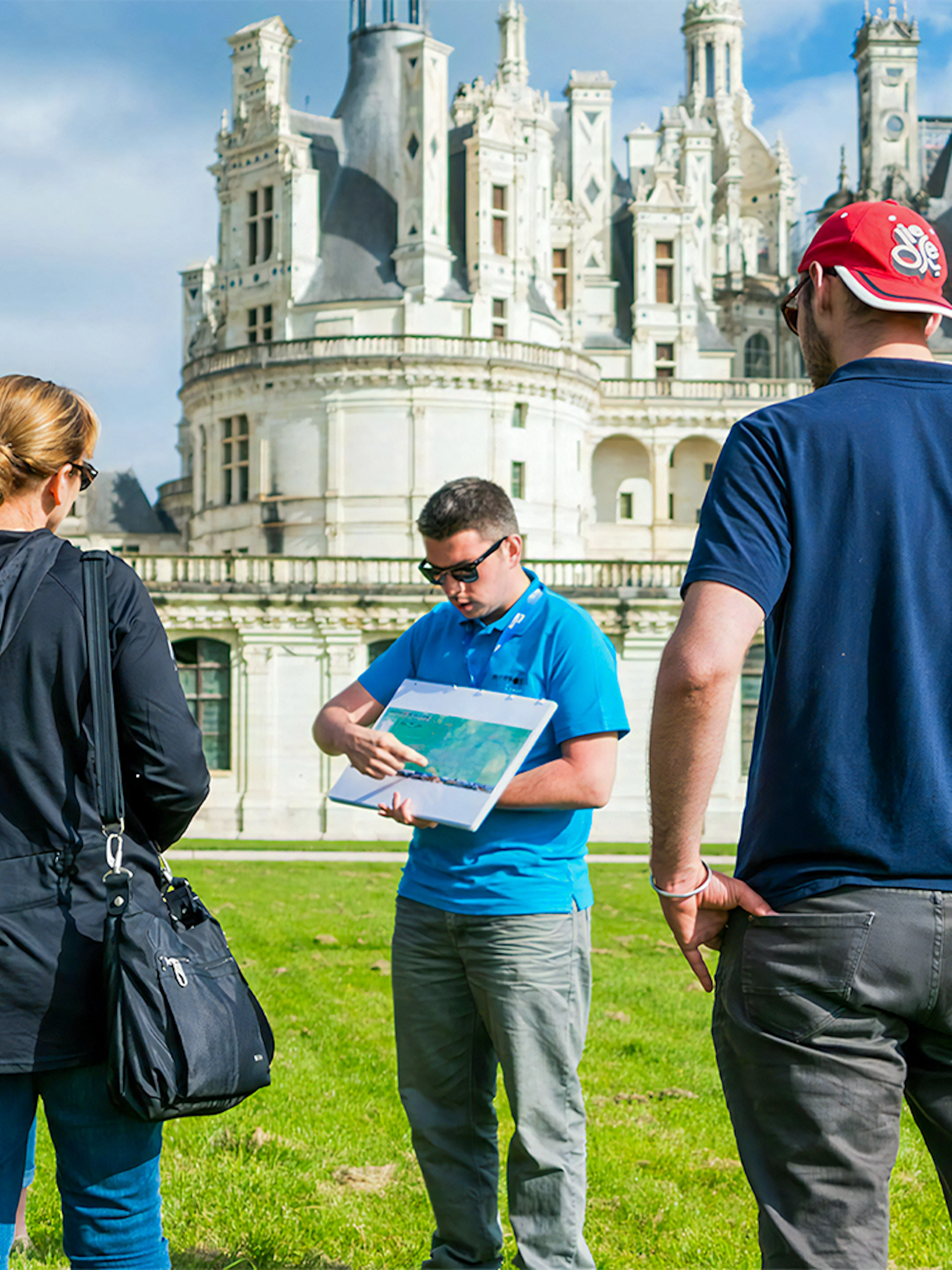 Tour group with guide at Château de Chambord in Loire Valley.