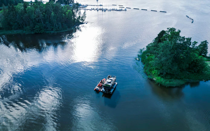 RIB boat navigating Helsinki archipelago waters, Finland.
