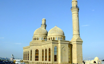 Mosque with domes and minaret on Gobustan and Absheron tour, Baku.