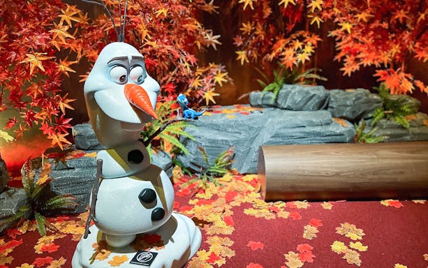 Olaf statue surrounded by autumn leaves at Disney 100 Village, Asiatique.