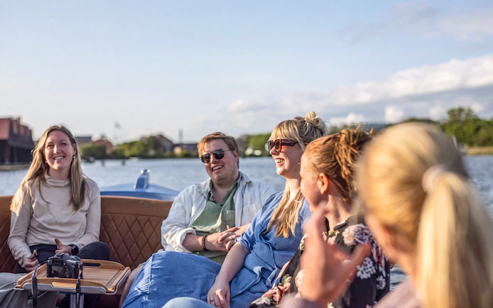 Group enjoying a canal tour in Copenhagen from Ved Stranden.