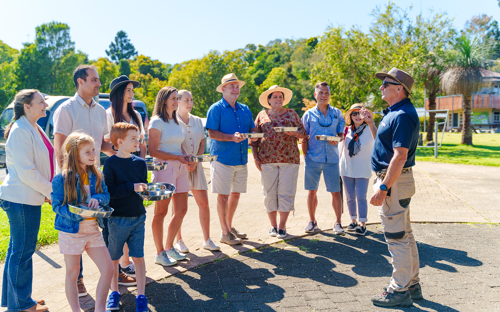 Tour guide briefing visitors with feeding trays at O'Reilly's Rainforest Retreat, Lamington National Park.