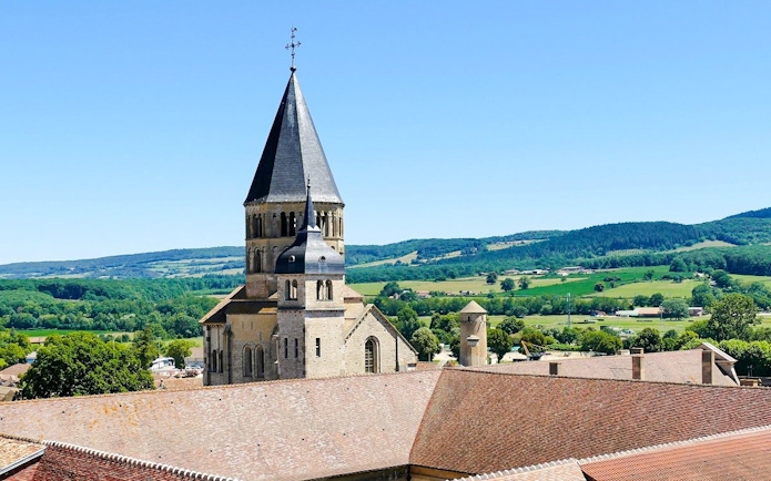 Cluny Abbey tower with scenic countryside in Lyon, France.