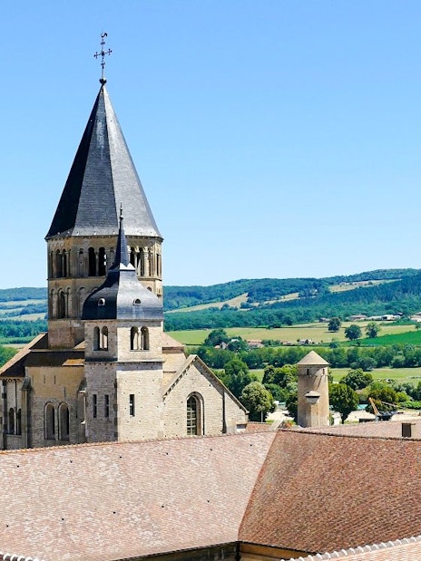 Cluny Abbey tower with scenic countryside in Lyon, France.