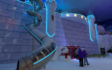 Genting Highlands Snow World Theme Park slide and snowman display.