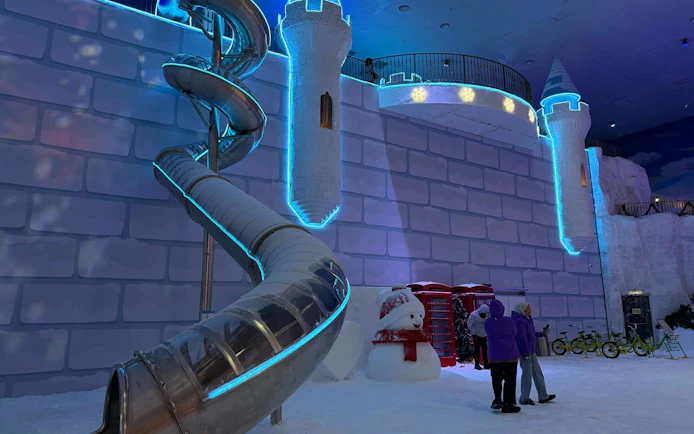 Genting Highlands Snow World Theme Park slide and snowman display.