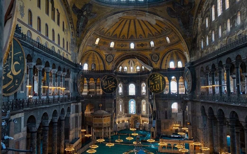 Hagia Sophia interior with ornate domes and Islamic calligraphy, Istanbul.