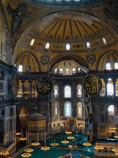 Hagia Sophia interior with ornate domes and Islamic calligraphy, Istanbul.