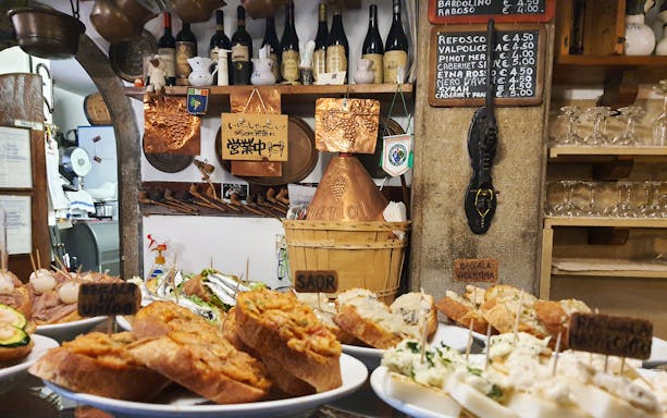 Venetian cicchetti displayed in a traditional bacaro during a Venice street food tour.