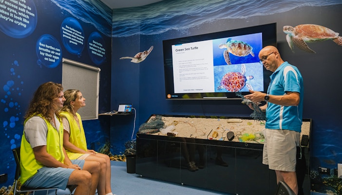 Cairns Aquarium marine life interactive display with diverse fish species.