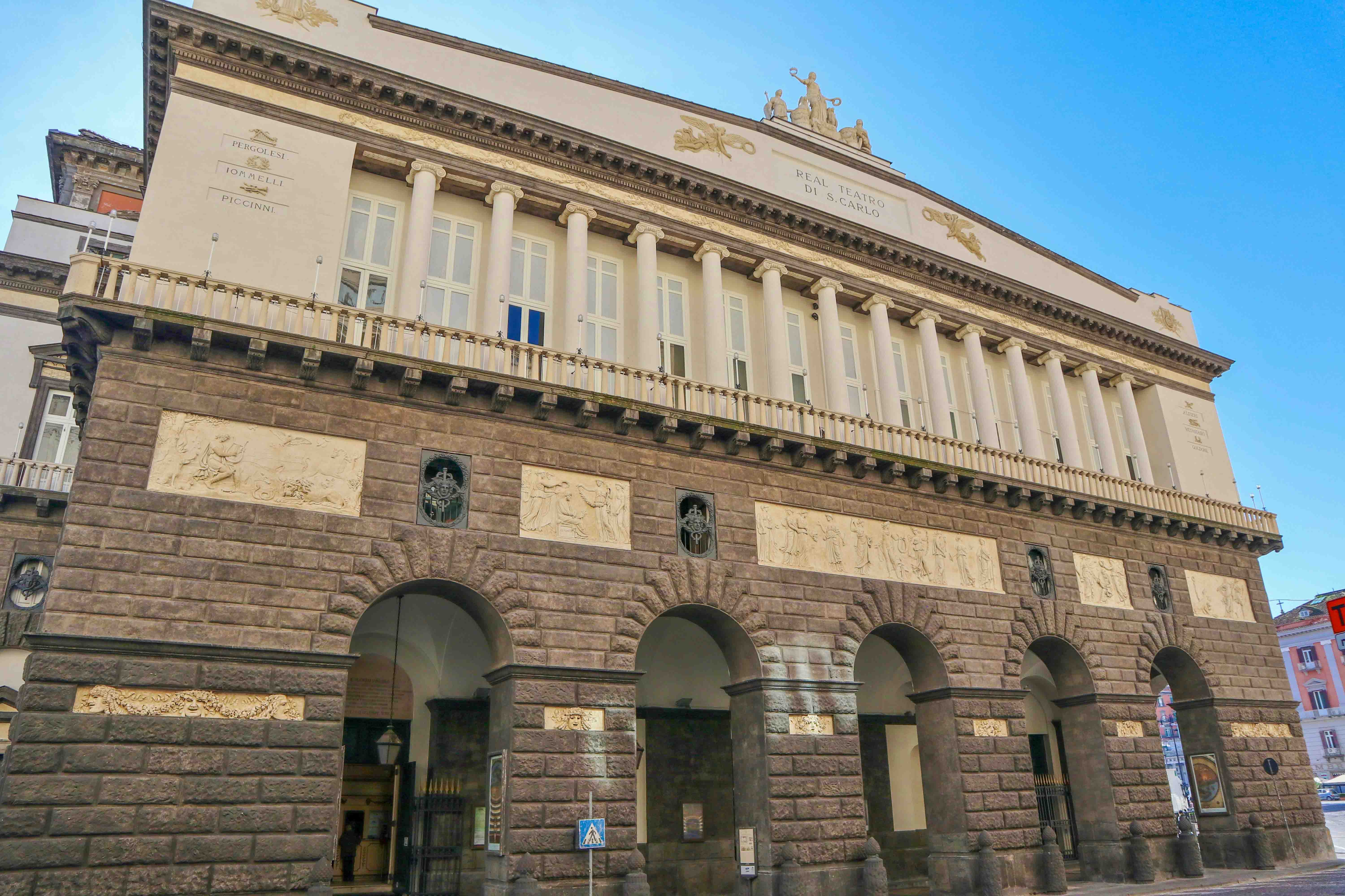Teatro San Carlo interior with ornate balconies and stage in Naples, Italy.