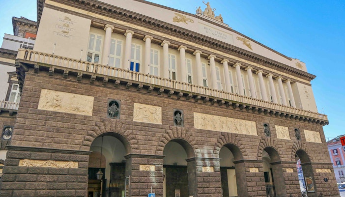 Teatro San Carlo interior with ornate balconies and stage in Naples, Italy.