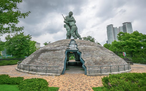 Monument of Korean War veterans at War Memorial of Korea, Seoul, with soldier statues.