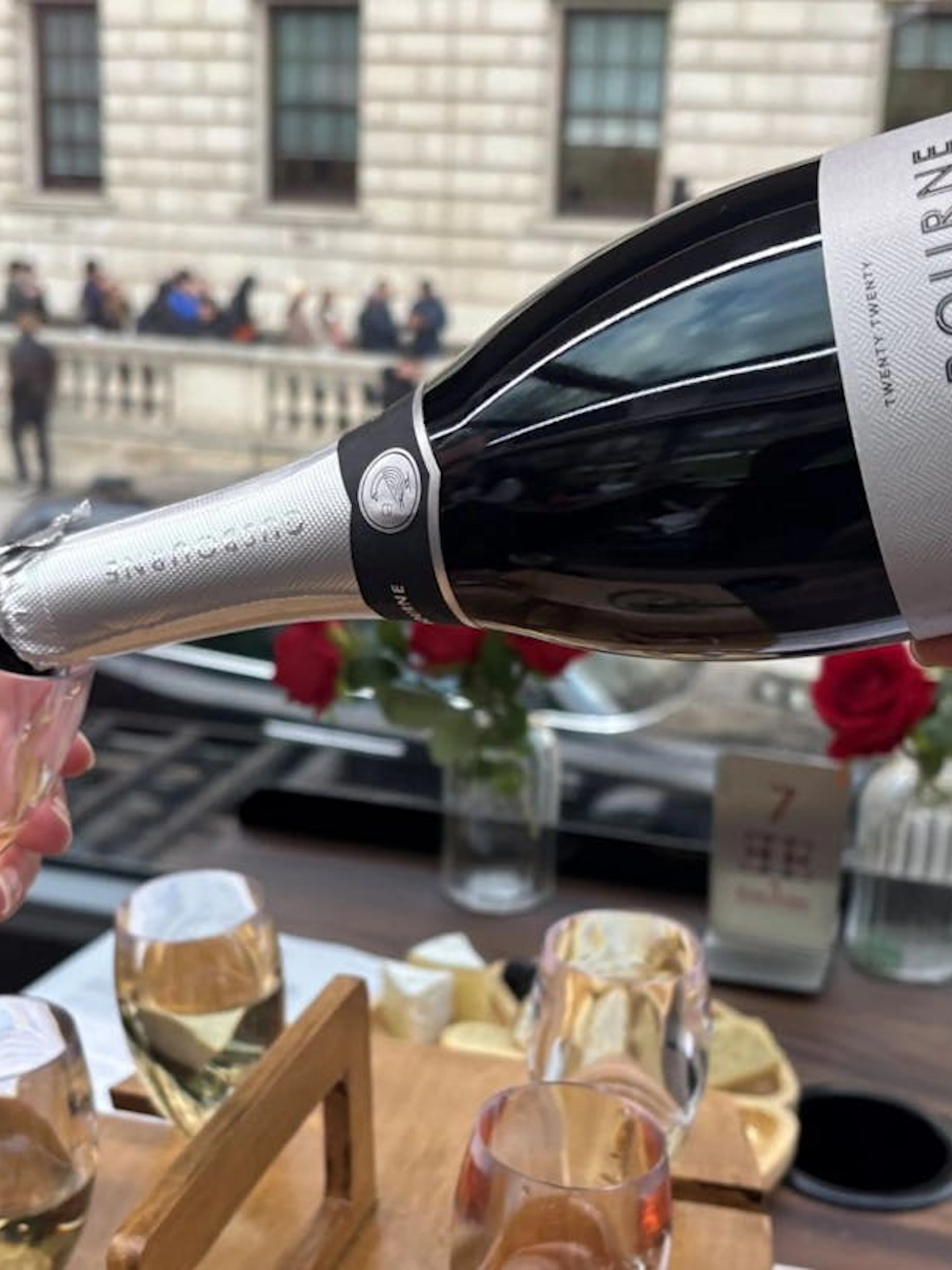 Pouring Gusbourne sparkling wine during London sightseeing tour.