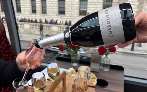 Pouring Gusbourne sparkling wine during London sightseeing tour.