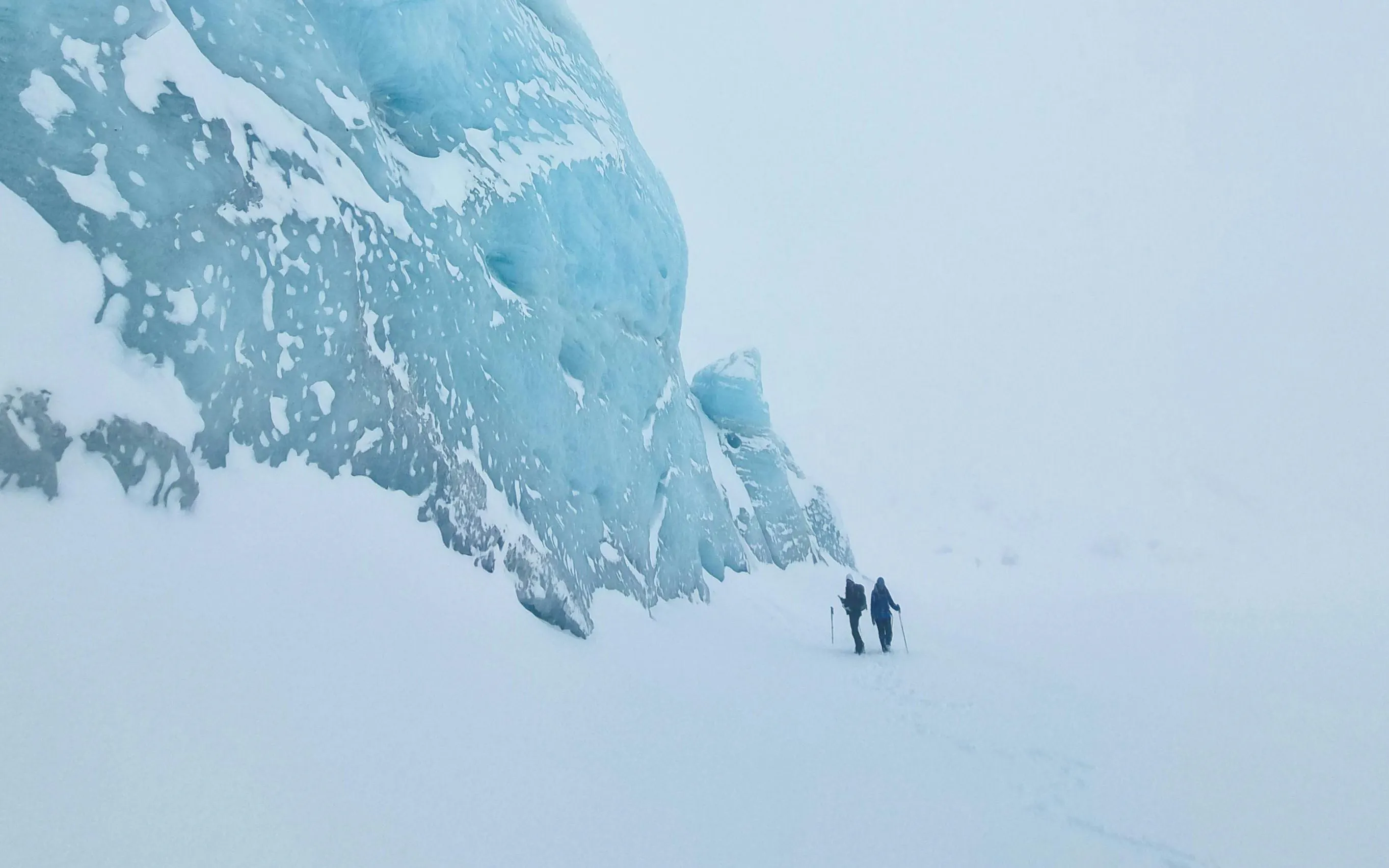 Trekking on snowy path beside Ojo del Albino Glacier, Argentina.