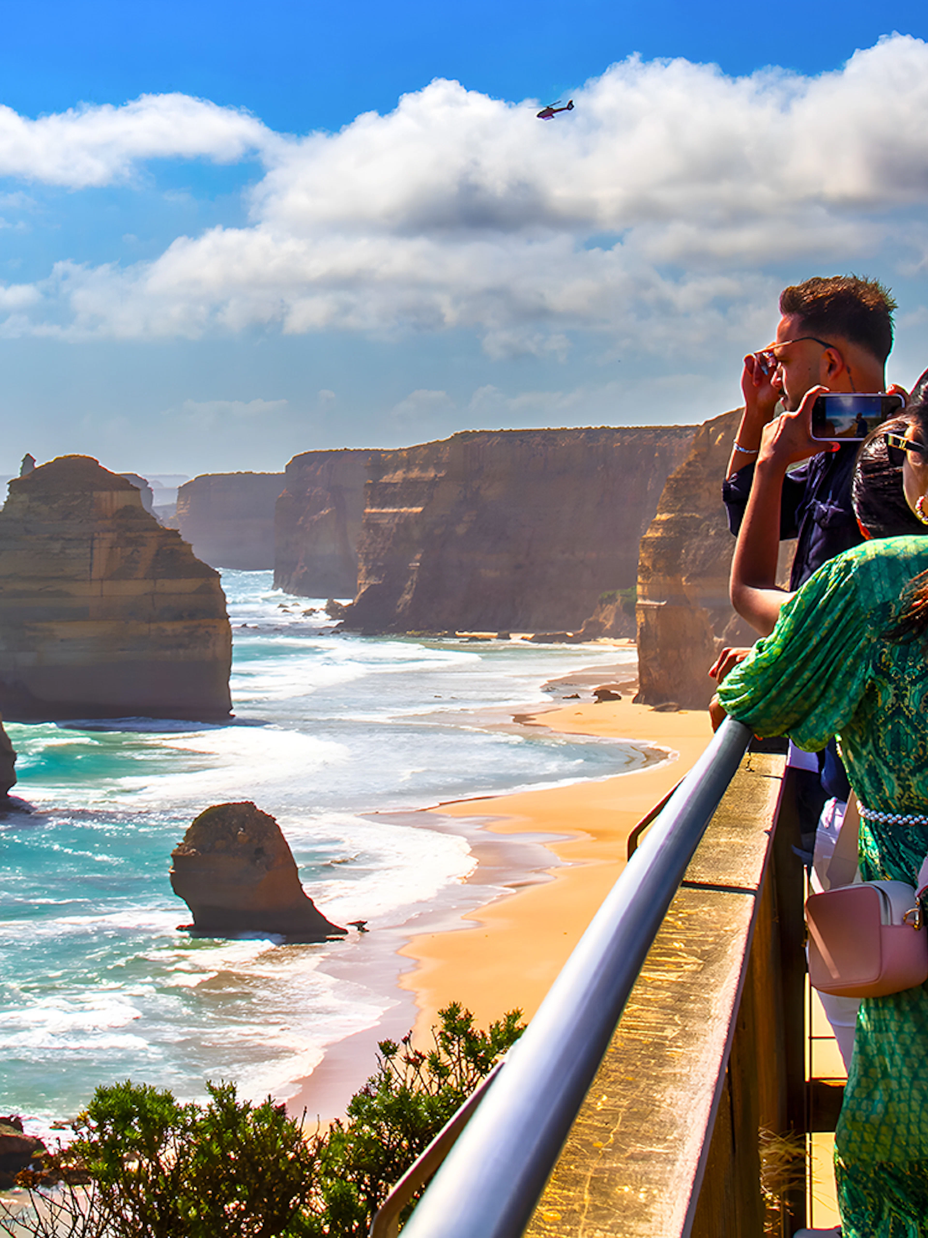 Tourists viewing the 12 Apostles on the Great Ocean Road guided tour.