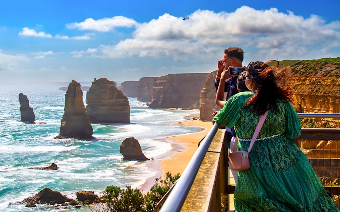 Tourists viewing the 12 Apostles on the Great Ocean Road guided tour.