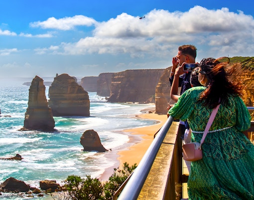 Tourists viewing the 12 Apostles on the Great Ocean Road guided tour.