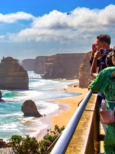 Tourists viewing the 12 Apostles on the Great Ocean Road guided tour.