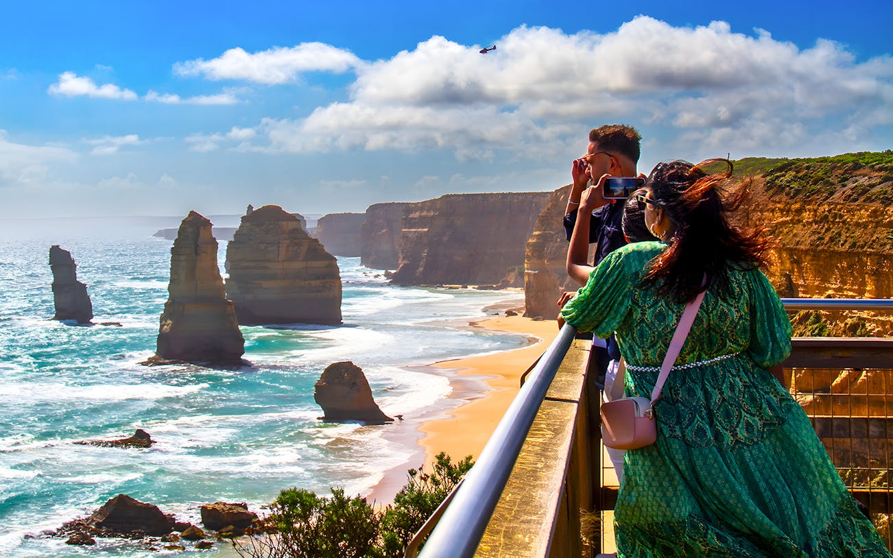 Tourists viewing the 12 Apostles on the Great Ocean Road guided tour.