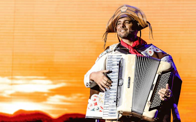 Musician playing accordion at Roxy Dinner Show in Rio de Janeiro.