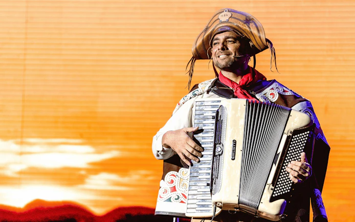 Musician playing accordion at Roxy Dinner Show in Rio de Janeiro.