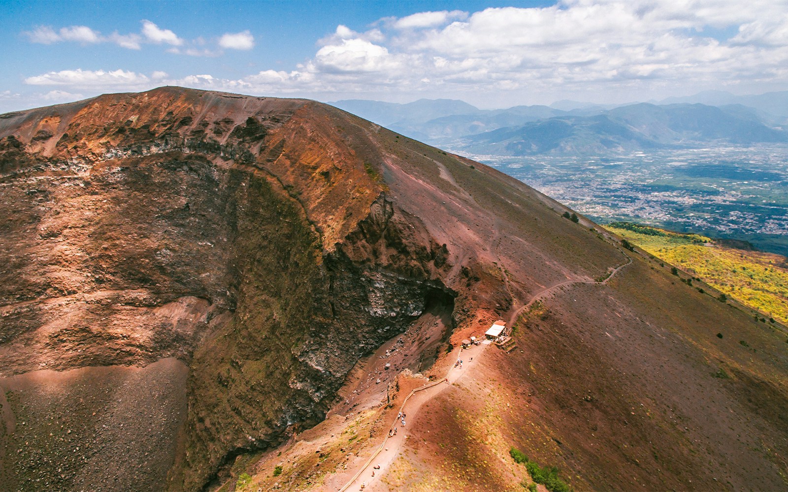 Mount Vesuvius with tourists exploring the crater rim, Naples, Italy, Skip-the-Line Tickets experience.