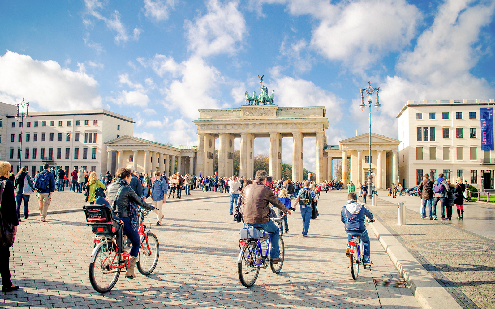 People cycling near Brandenburg Gate, Berlin, Germany