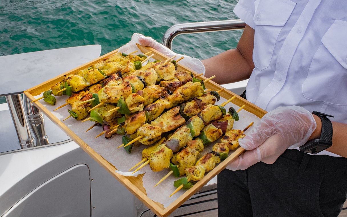 Grilled skewers served on Superyacht TriDeck Cruise.
