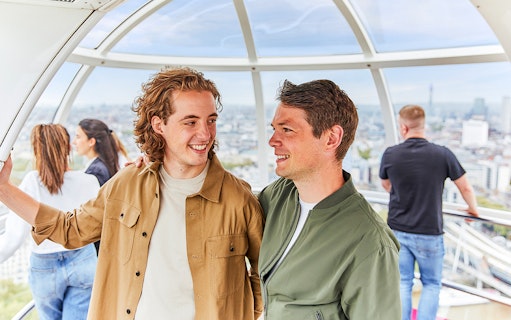 Couple enjoying the view inside a London Eye capsule.