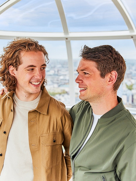 Couple enjoying the view inside a London Eye capsule.