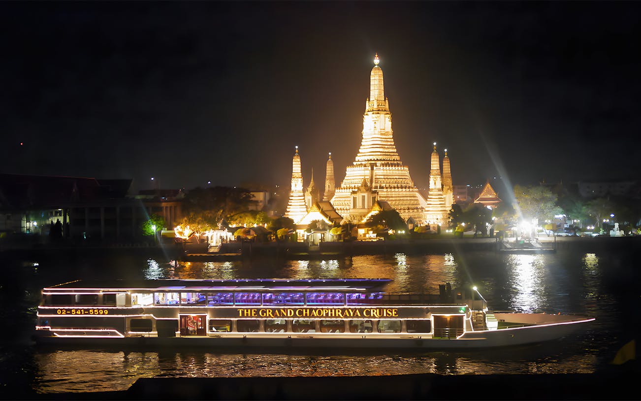 Chao Phraya dinner cruise passing Wat Arun at night, Bangkok.